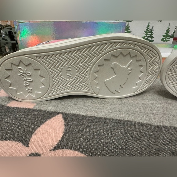 Description:
Adorable pink high-top sneakers brand new! - Picture 4 of 4